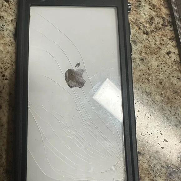 IPhone SE 64 GB through straighttalk back screen cracked but works great